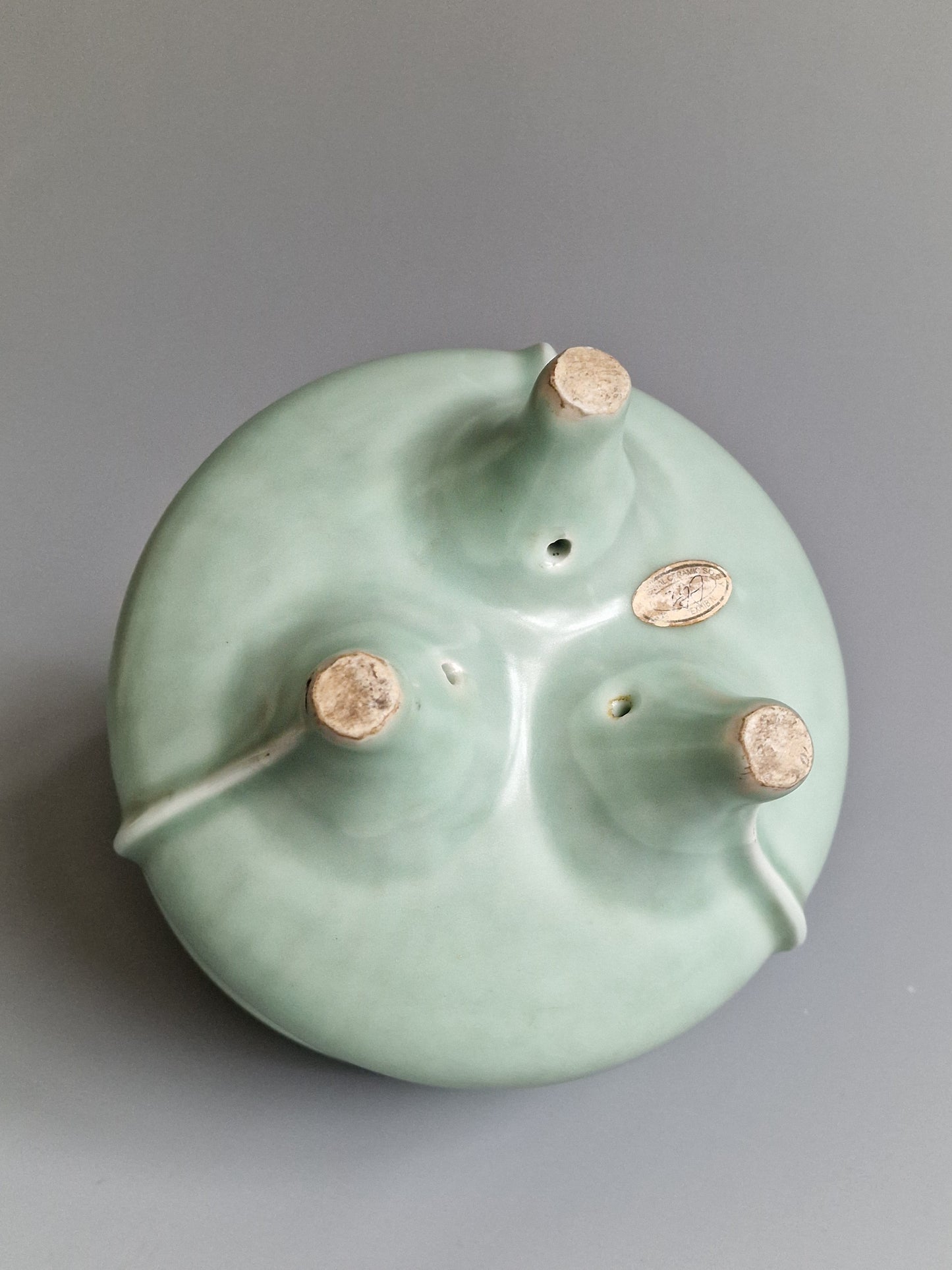 A Chinese Longquan celadon tripod censer