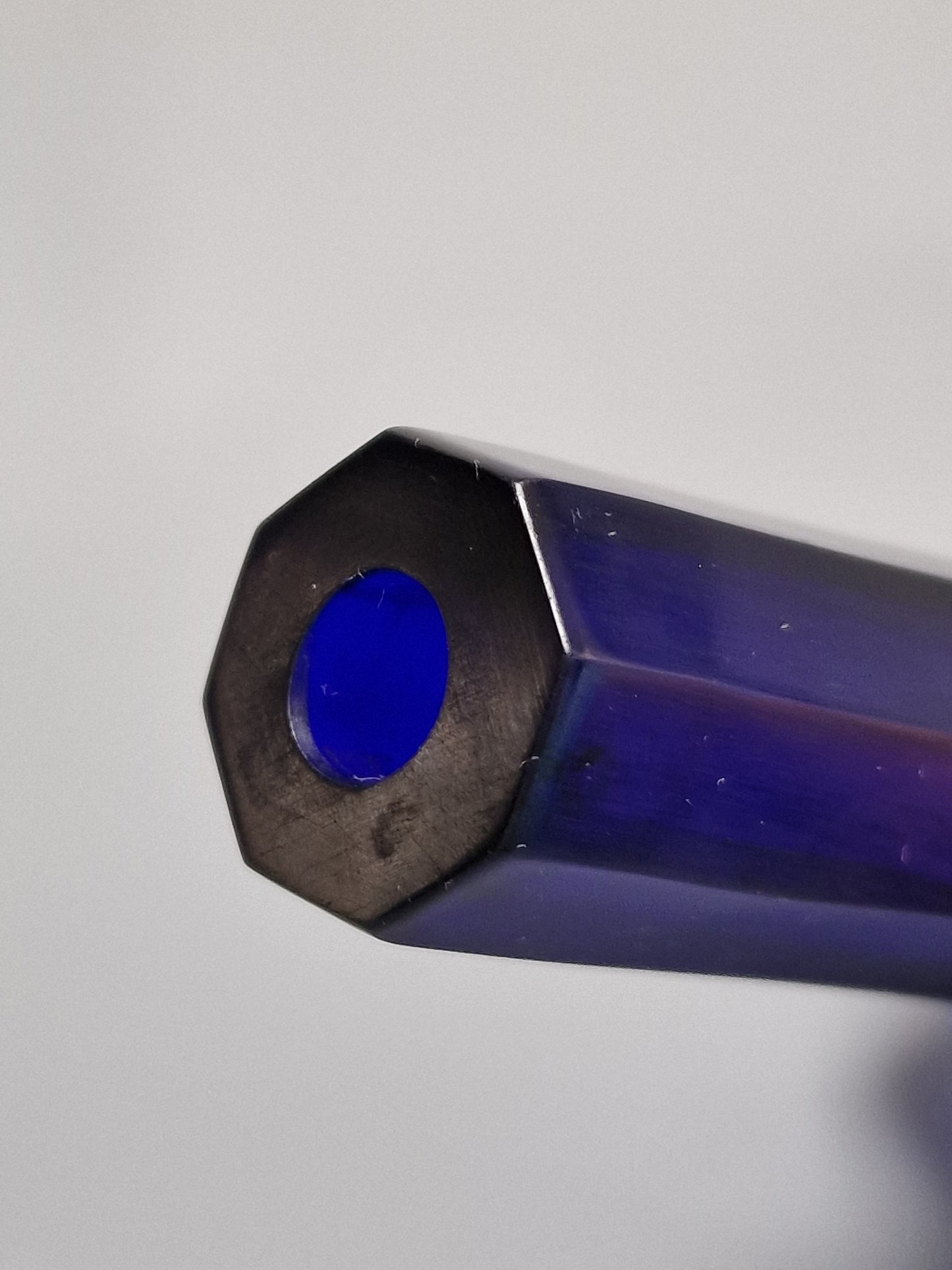 A Chinese blue Beijing glass octagonal bottle vase, Qianlong mark, with an Emery & Cie, Paris label — Republic period (1912–1949)