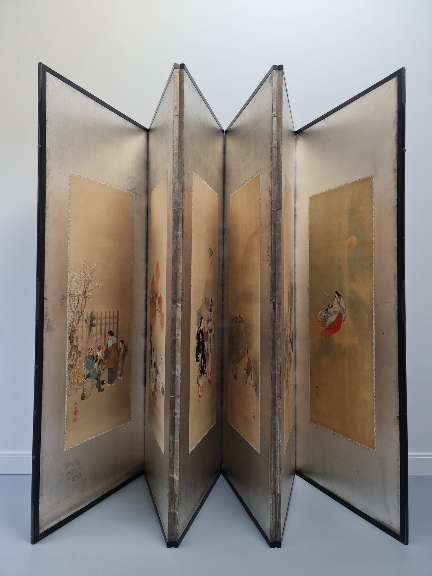 A Japanese six-panel screen with hand-painted silk scenes by six artists – Meiji/Taishō period (circa 1900–1920