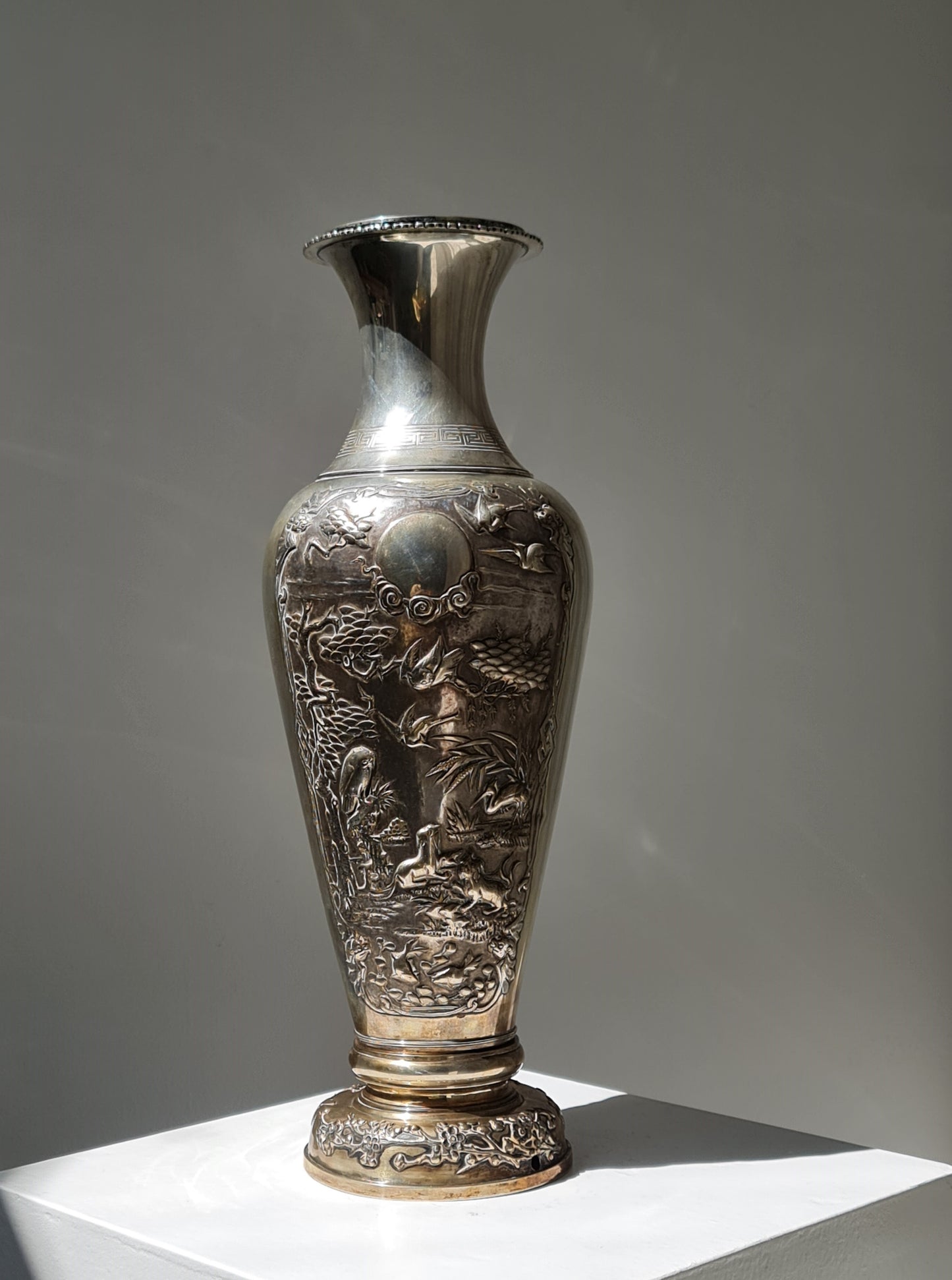 A Chinese Hongkong silver vase with birds, deer, and floral motifs — Republic period (early 20th century)