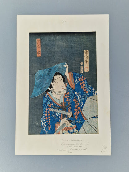 A Japanese woodblock print of a kabuki actor with blue robe and hat — Toyohara Kunichika (1835–1900), Meiji period