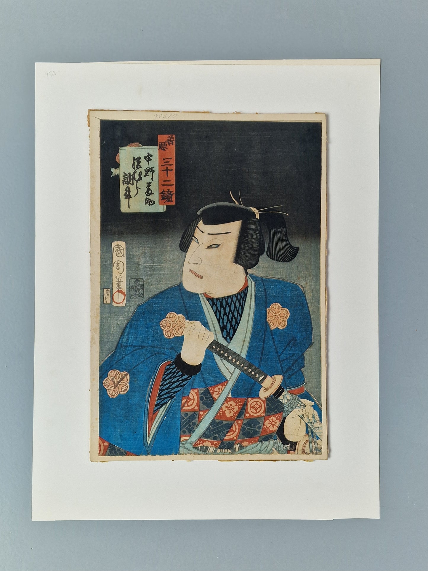 A Japanese woodblock print of a kabuki actor with sword — Toyohara Kunichika (1835–1900), Meiji period