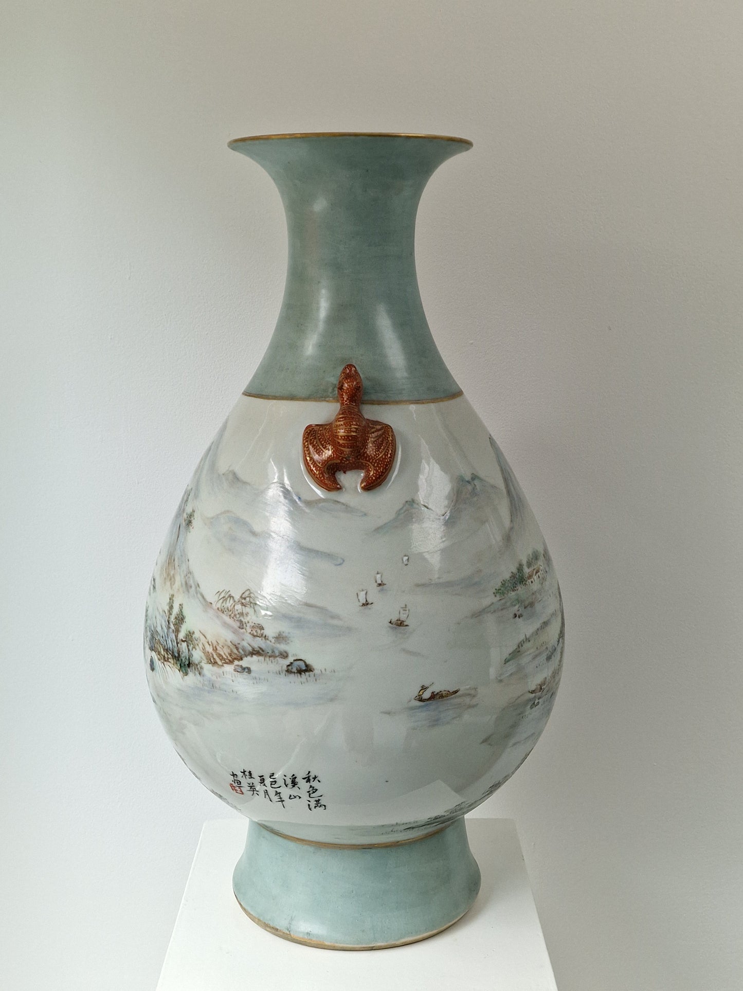 A large Chinese porcelain vase with landscape decoration and moulded bat handles — 20th century