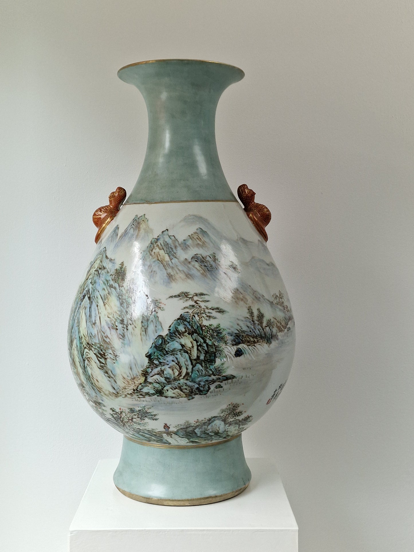 A large Chinese porcelain vase with landscape decoration and moulded bat handles — 20th century