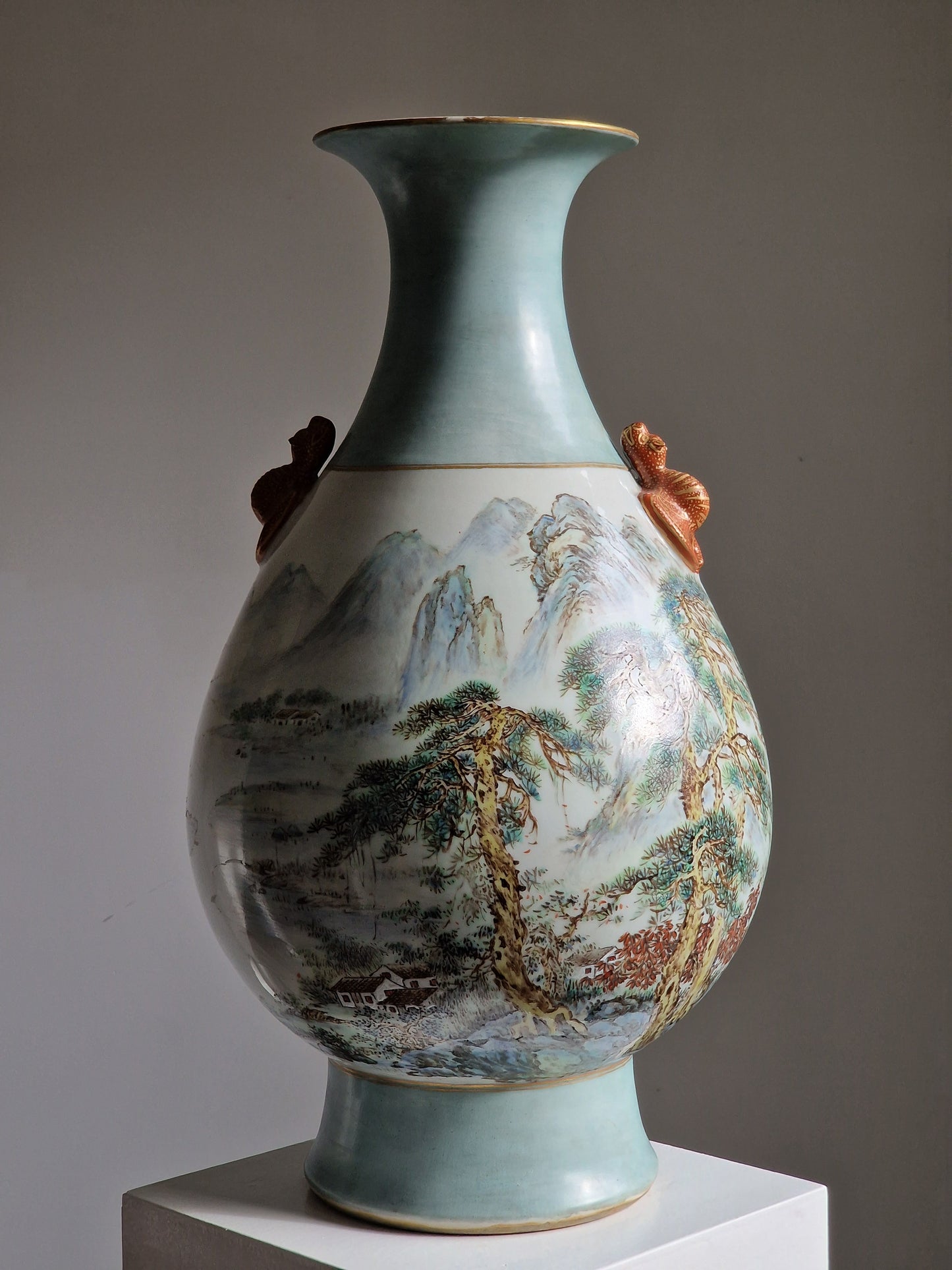 A large Chinese porcelain vase with landscape decoration and moulded bat handles — 20th century