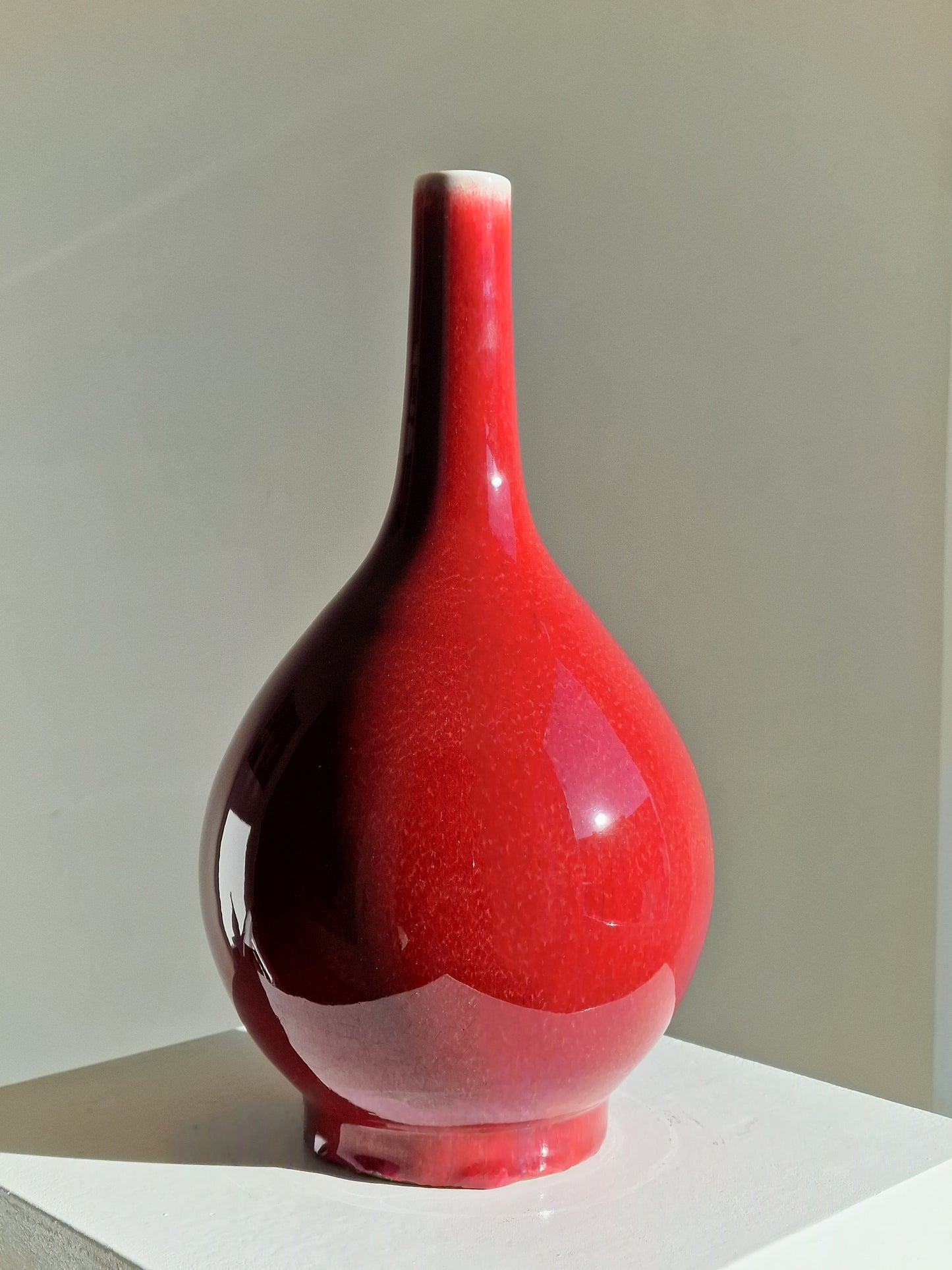 A Chinese ruby-red glazed porcelain bottle vase — 19th century