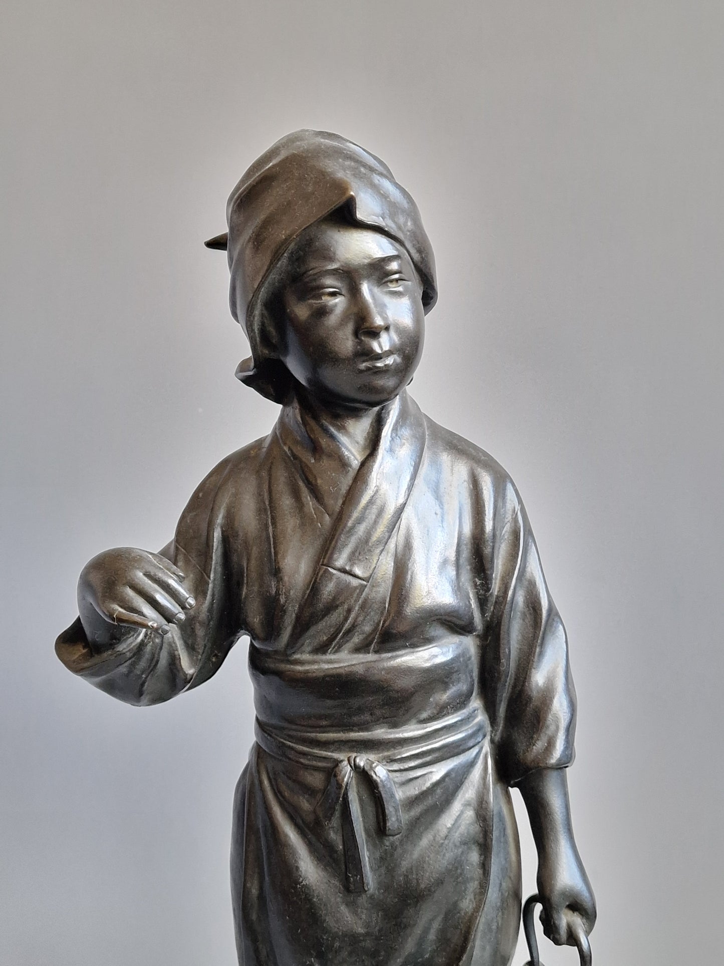 A Japanese Bronze Okimono of a Peasant Girl — Meiji period (1868–1912)