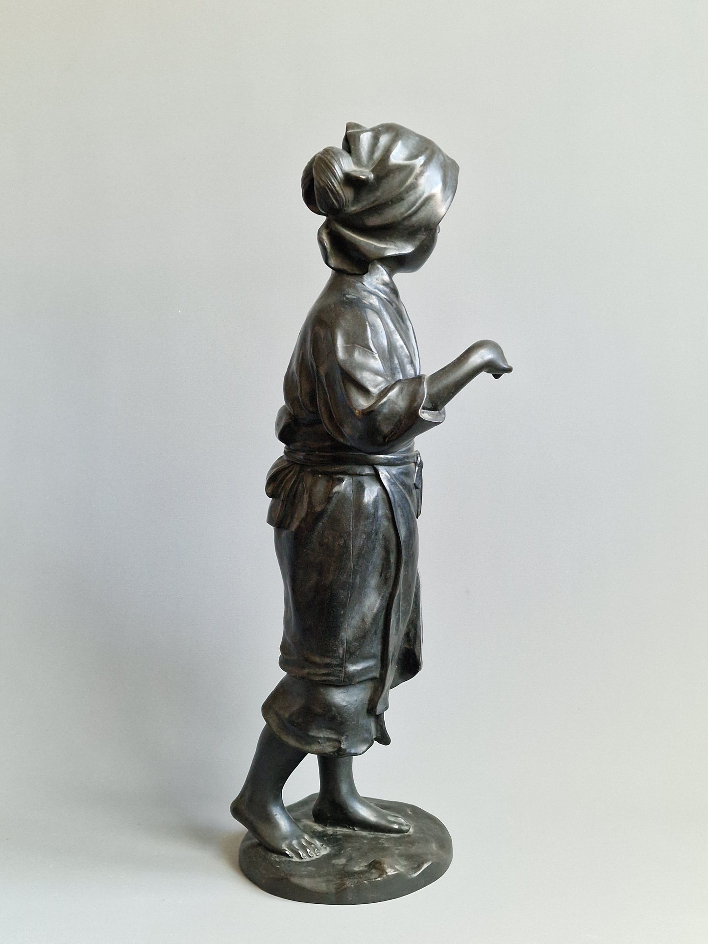 A Japanese Bronze Okimono of a Peasant Girl — Meiji period (1868–1912)