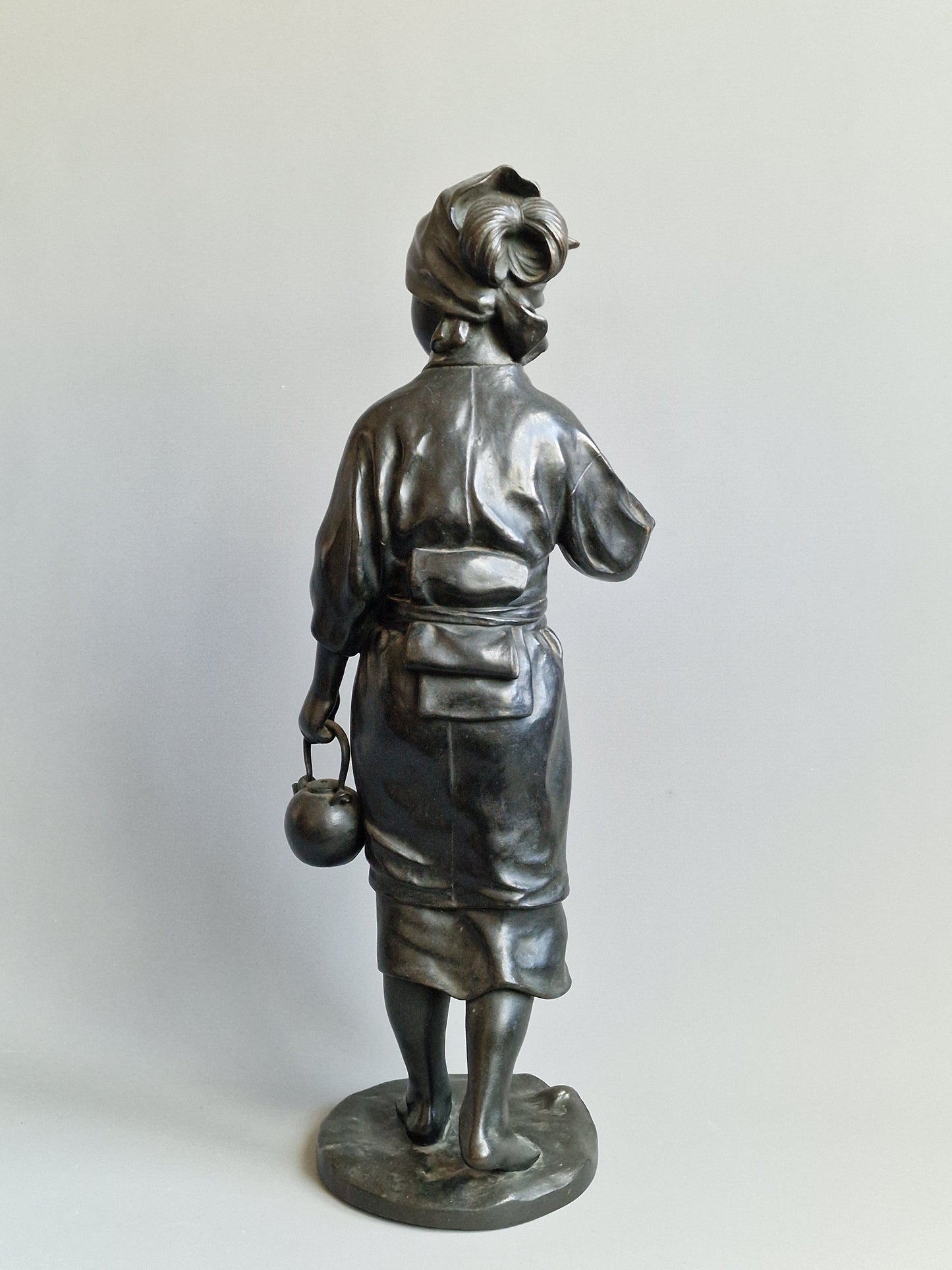 A Japanese Bronze Okimono of a Peasant Girl — Meiji period (1868–1912)