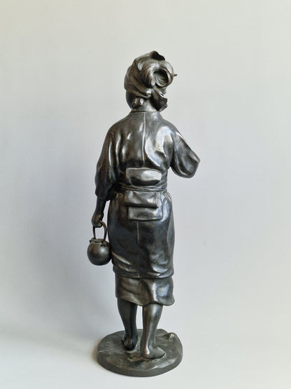 A Japanese Bronze Okimono of a Peasant Girl — Meiji period (1868–1912)