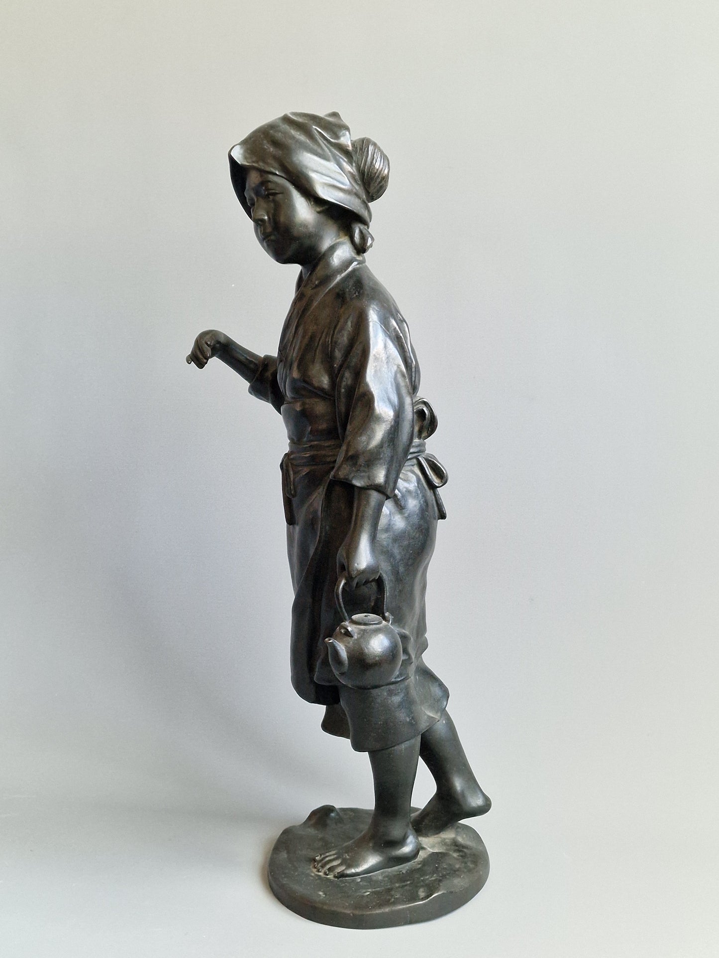 A Japanese Bronze Okimono of a Peasant Girl — Meiji period (1868–1912)