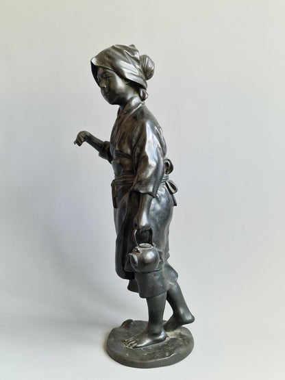 A Japanese Bronze Okimono of a Peasant Girl — Meiji period (1868–1912)