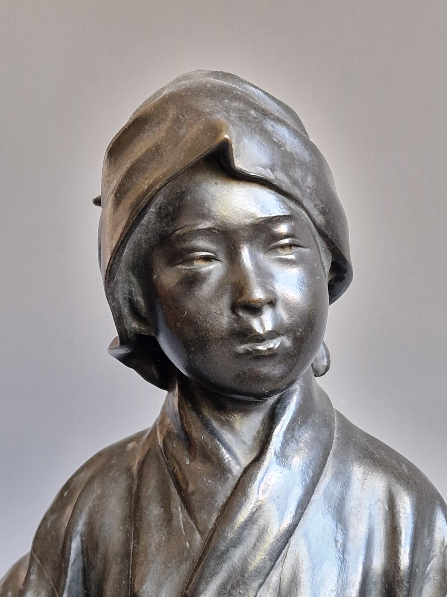 A Japanese Bronze Okimono of a Peasant Girl — Meiji period (1868–1912)