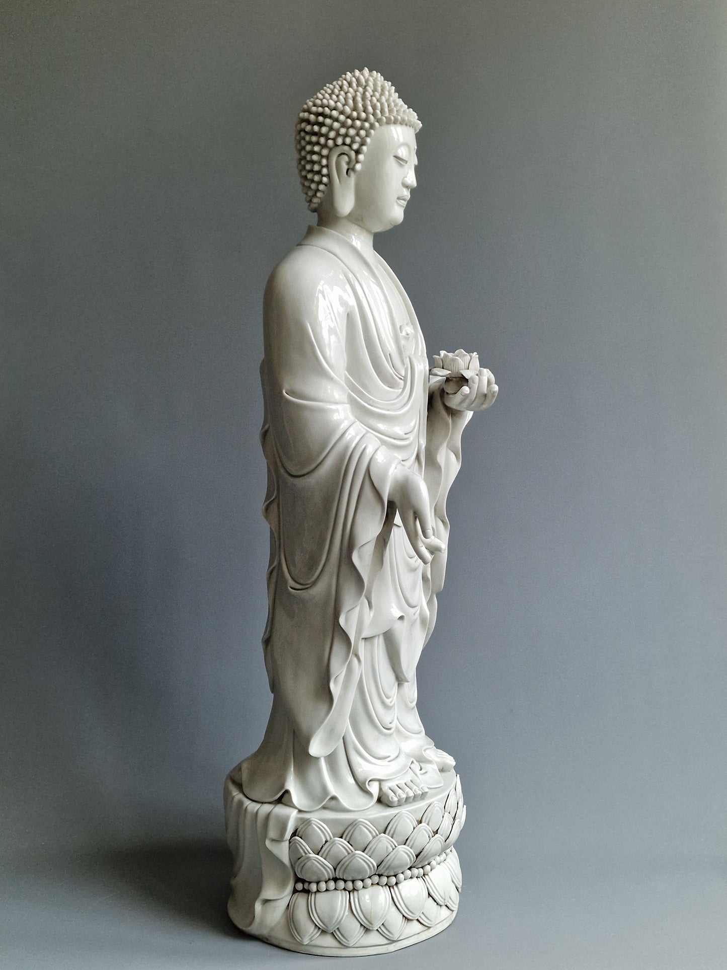 A large Dehua blanc-de-chine figure of Amitabha Buddha with apocryphal He Chaozong and Dehua marks — 19th/20th century