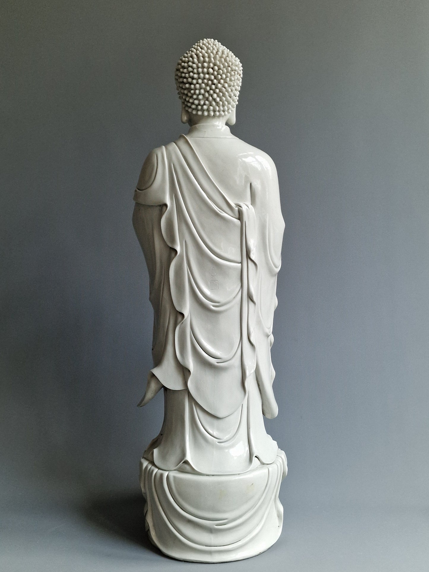 A large Dehua blanc-de-chine figure of Amitabha Buddha with apocryphal He Chaozong and Dehua marks — 19th/20th century