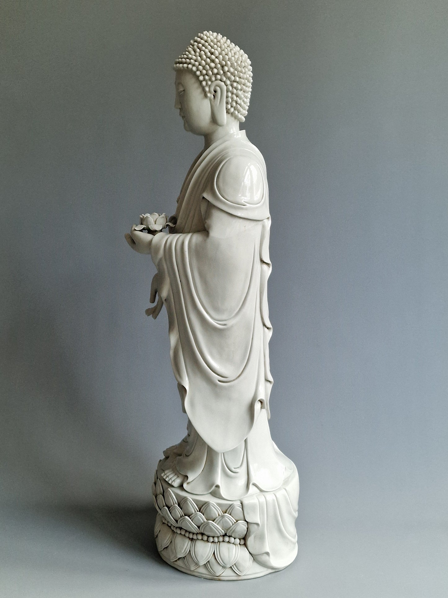 A large Dehua blanc-de-chine figure of Amitabha Buddha with apocryphal He Chaozong and Dehua marks — 19th/20th century