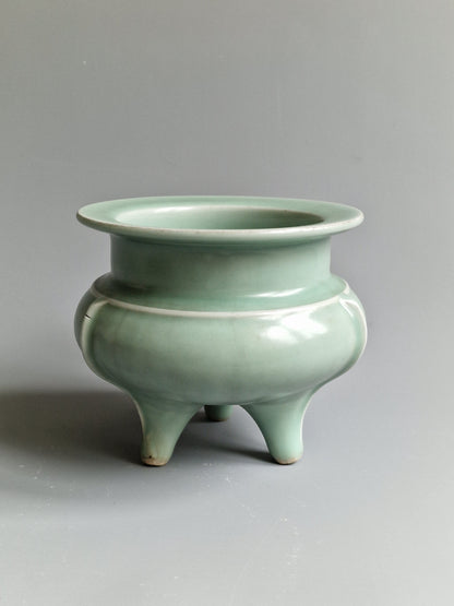 A Chinese Longquan celadon tripod censer