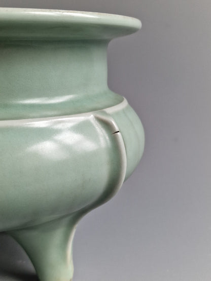 A Chinese Longquan celadon tripod censer