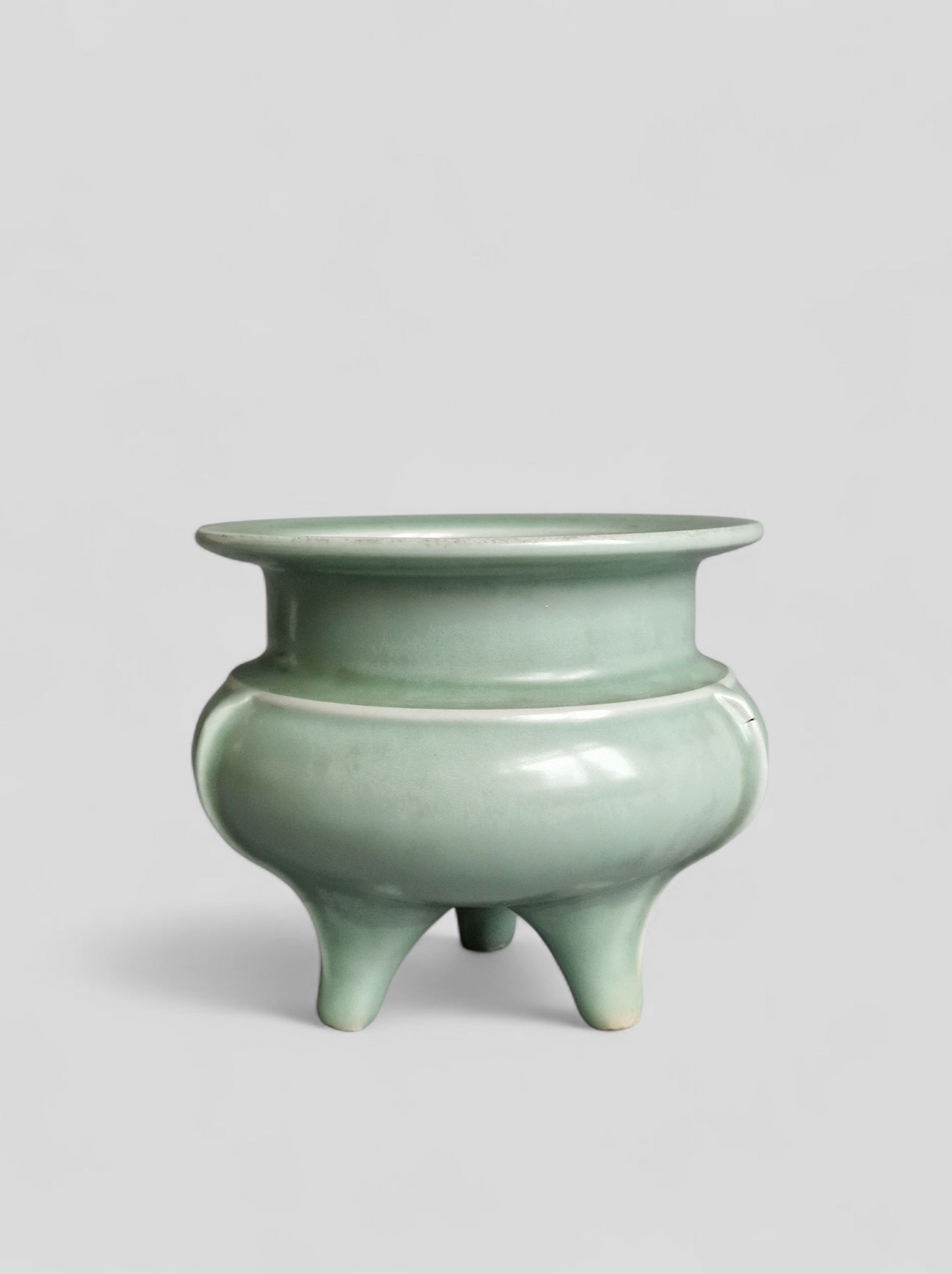 A Chinese Longquan celadon tripod censer