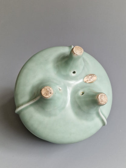 A Chinese Longquan celadon tripod censer