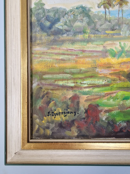 A Bogor (Indonesia) landscape with figures, oil on canvas, by S. Djuprijany — dated 1970