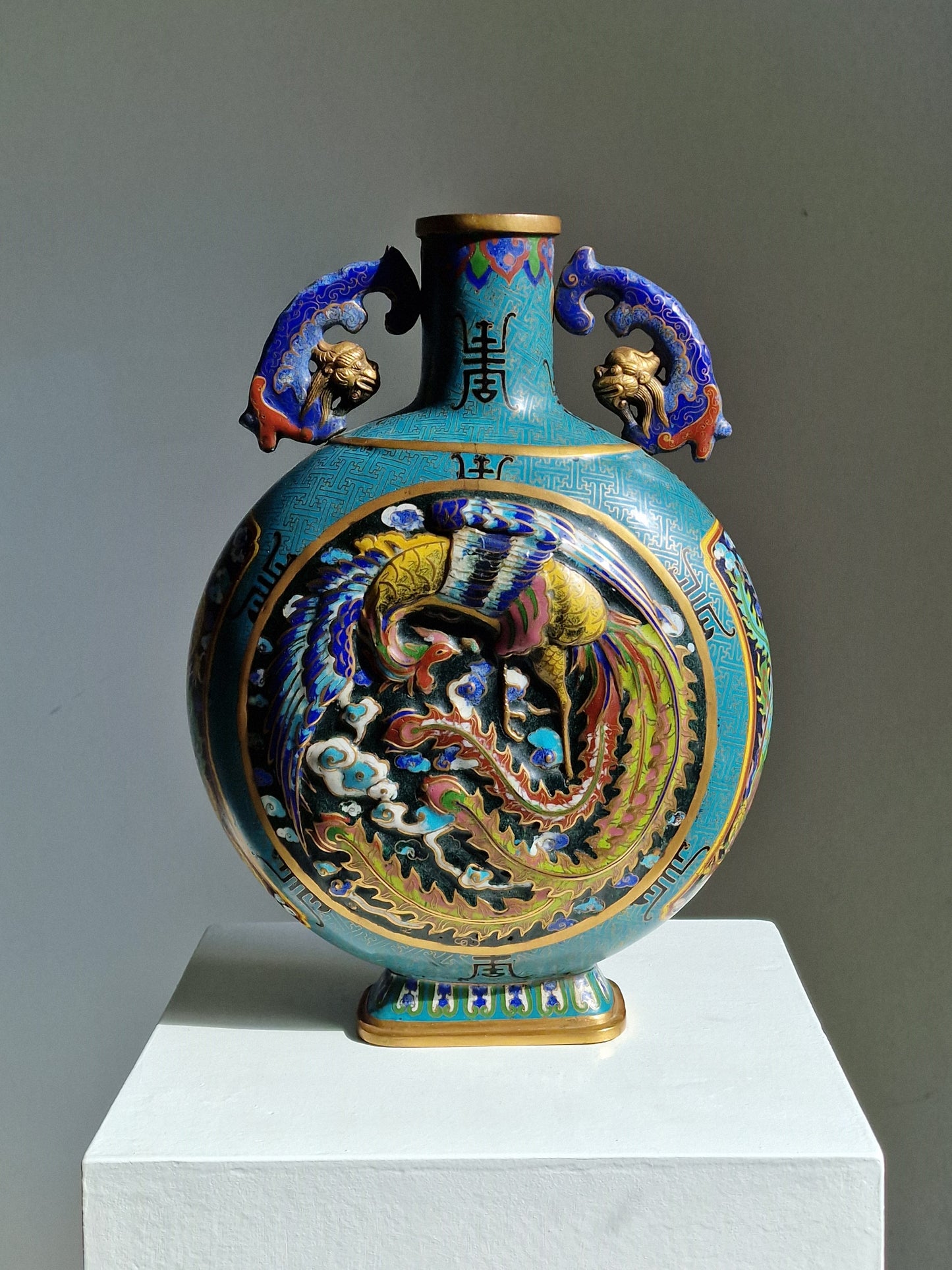 A Chinese cloisonné enamel moon flask with dragon and phoenix decoration, Qianlong mark, late 19th–early 20th century