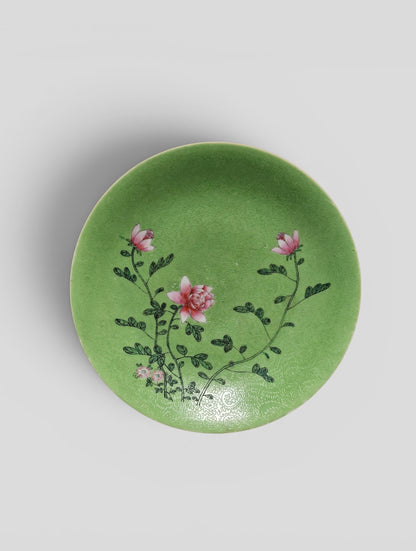 A Chinese famille rose lime-green sgraffito-ground porcelain dish with floral decoration, Guangxu mark and probably of the period (1875–1908)