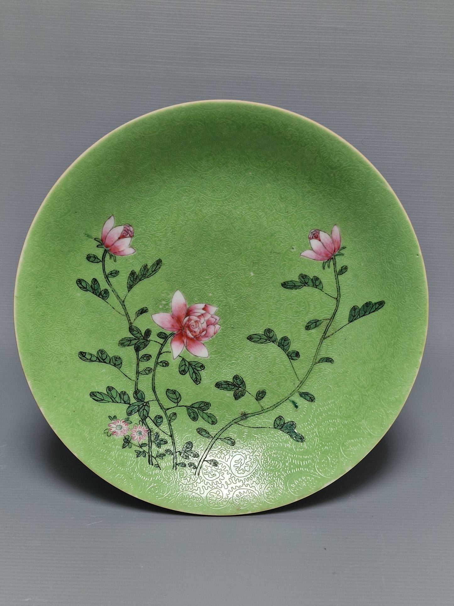 A Chinese famille rose lime-green sgraffito-ground porcelain dish with floral decoration, Guangxu mark and probably of the period (1875–1908)
