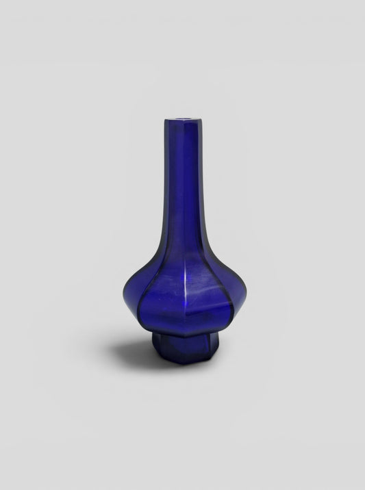 A Chinese blue Beijing glass octagonal bottle vase, Qianlong mark, with an Emery & Cie, Paris label — Republic period (1912–1949)