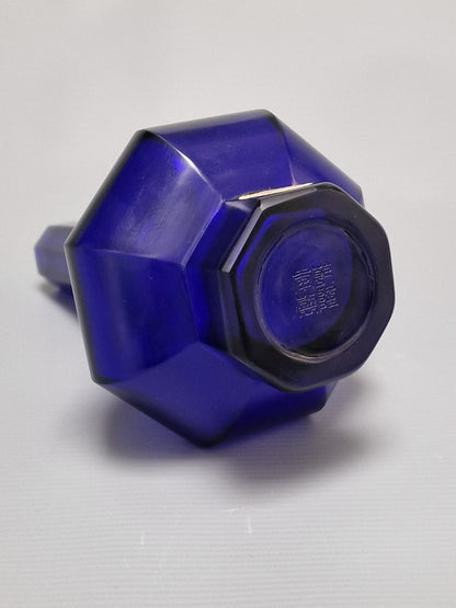 A Chinese blue Beijing glass octagonal bottle vase, Qianlong mark, with an Emery & Cie, Paris label — Republic period (1912–1949)