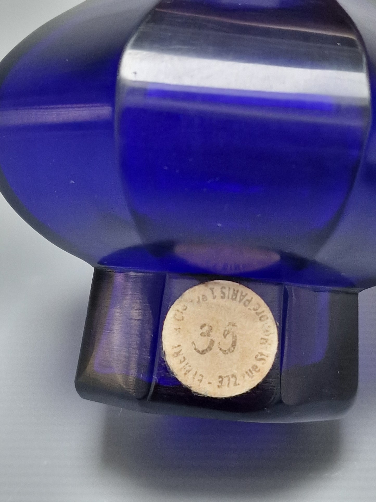 A Chinese blue Beijing glass octagonal bottle vase, Qianlong mark, with an Emery & Cie, Paris label — Republic period (1912–1949)