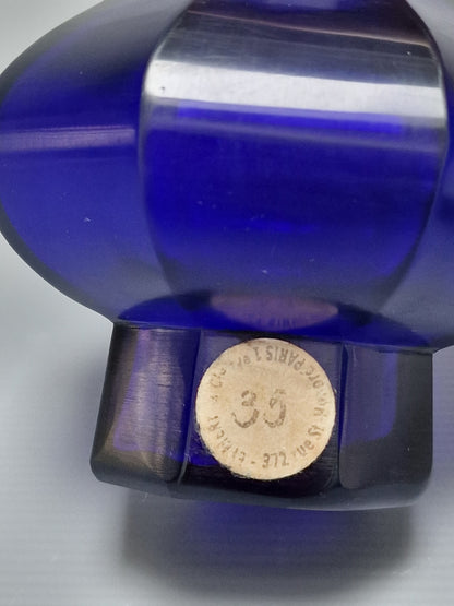 A Chinese blue Beijing glass octagonal bottle vase, Qianlong mark, with an Emery & Cie, Paris label — Republic period (1912–1949)