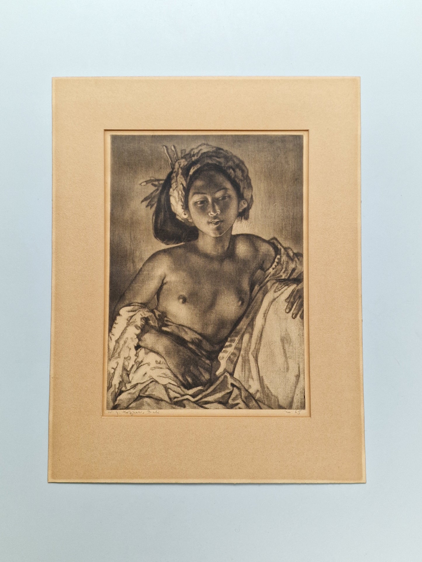 A framed Portrait of a Balinese Woman by W. G. Hofker, signed and numbered No. 65 — mid-20th century
