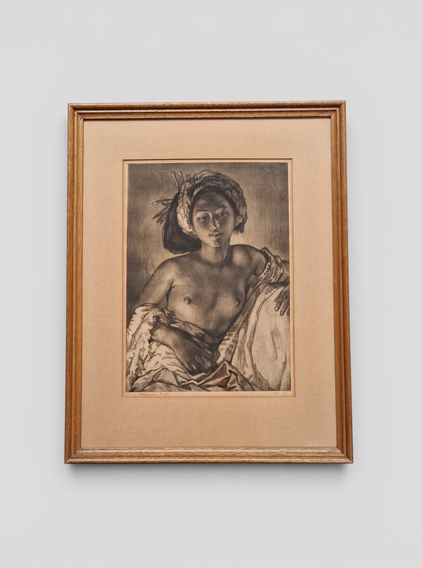 A framed Portrait of a Balinese Woman by W. G. Hofker, signed and numbered No. 65 — mid-20th century