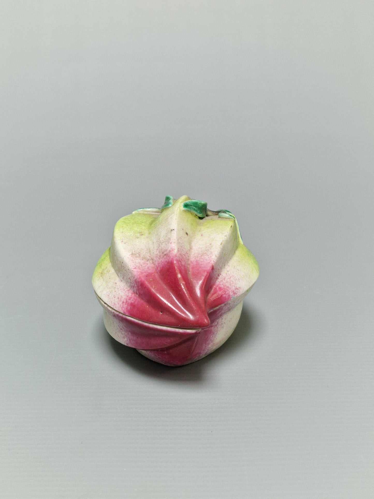 A Chinese famille rose porcelain peach-form covered box — Qing Dynasty, 19th Century