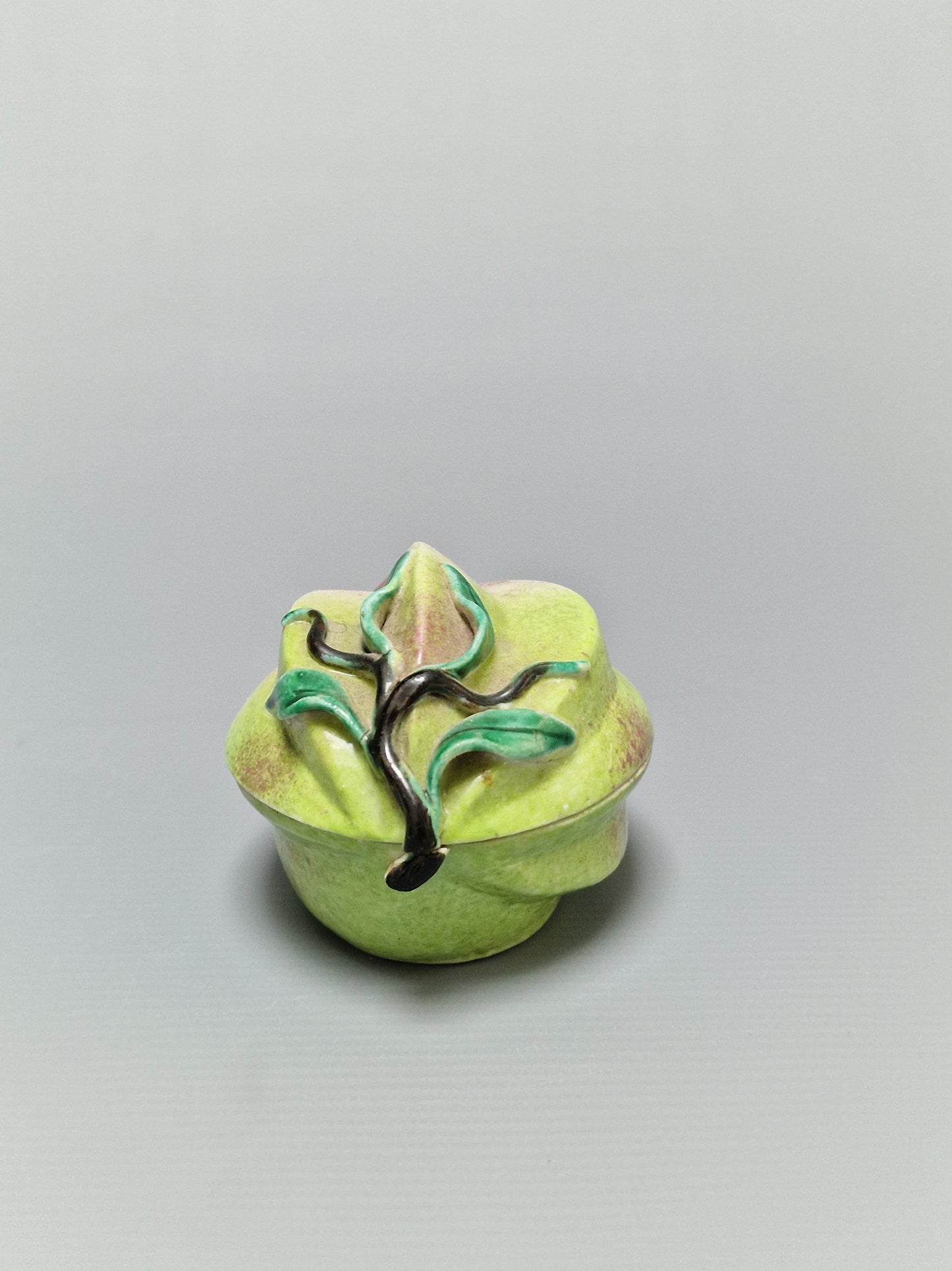 A Chinese famille rose porcelain peach-form covered box — Qing Dynasty, 19th Century