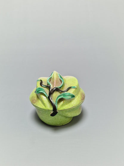 A Chinese famille rose porcelain peach-form covered box — Qing Dynasty, 19th Century