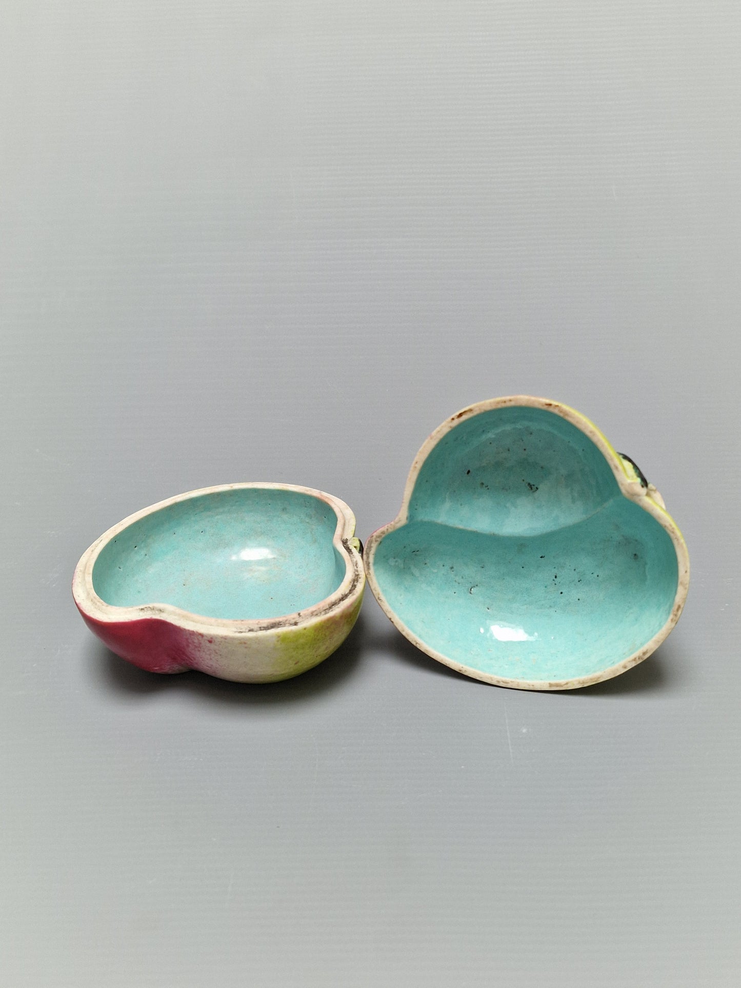 A Chinese famille rose porcelain covered box in the form of a peach — Qing Dynasty, 19th century