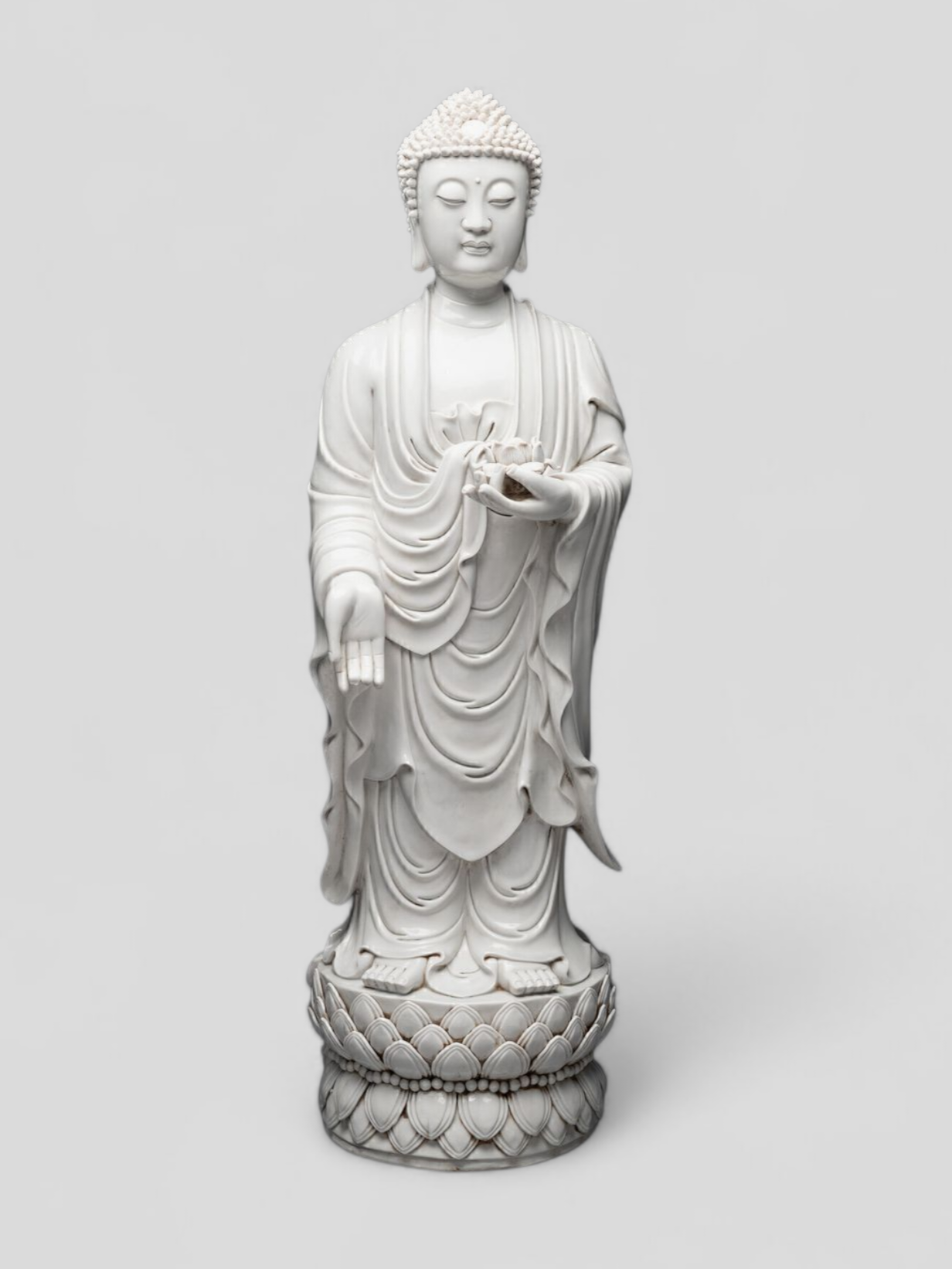 A large Dehua blanc-de-chine figure of Amitabha Buddha with apocryphal He Chaozong and Dehua marks — 19th/20th century