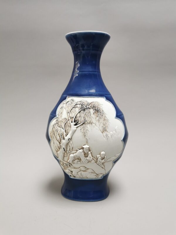 A rare Chinese vase shaped like bamboo and carved with drawings on both sides