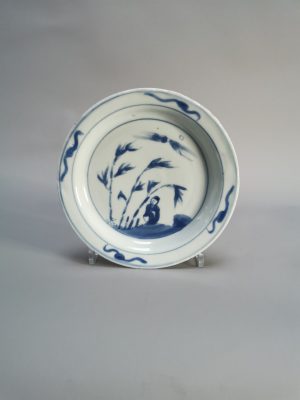 A Chinese porcelain plate featuring a lady with bamboo, dating to the Tianqi/Chongzhen period, approximately 1621-1644