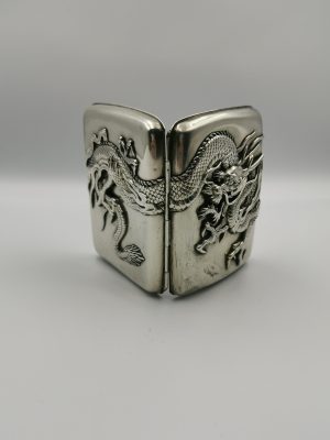 A Chinese silver cigarette case with dragon decoration from the late Qing dynasty