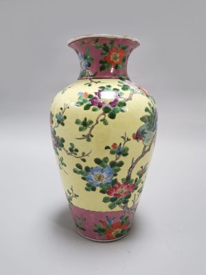 A Japanese porcelain vase with a rich colorful enamel exotic bird and flower scene, iron red marked, Early 20th century