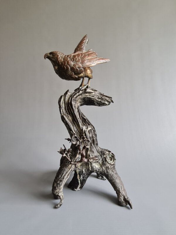 A large Japanese falcon perched on a branch, bronze sculpture (okimono), Meiji period (1868-1912)