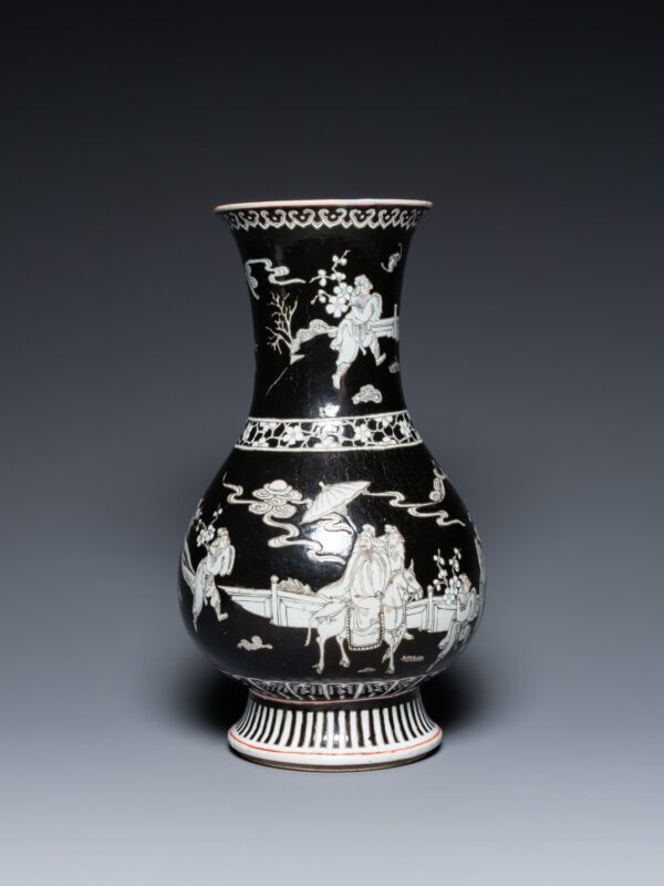 A Chinese black-ground vase decorated in grisaille with a figure on horseback with attendants, 19th century