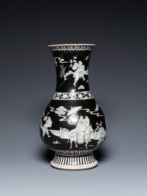 A Chinese black-ground vase decorated in grisaille with a figure on horseback with attendants, 19th century