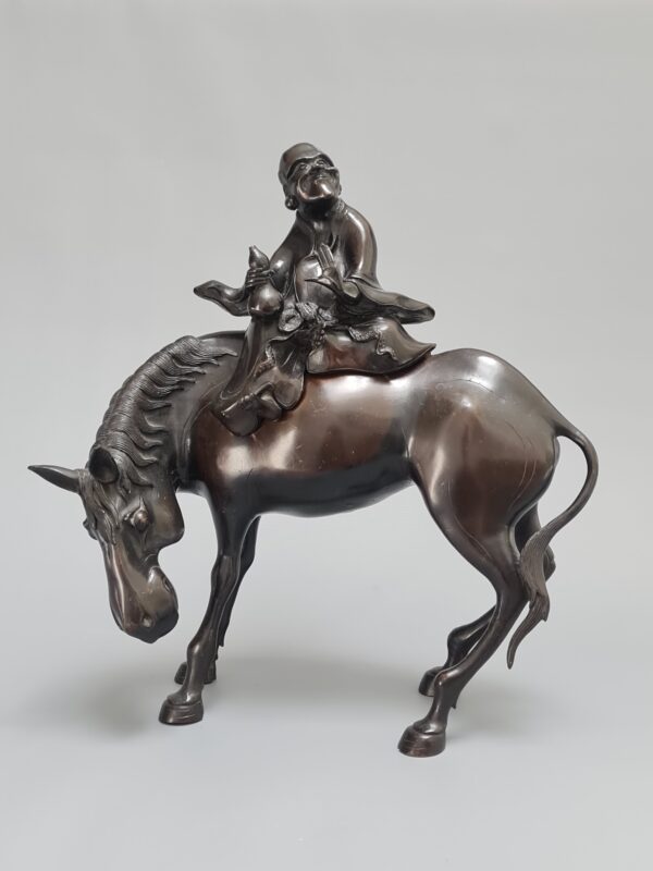 A Chinese bronze figure of a sage on a horse, Qing Dynasty